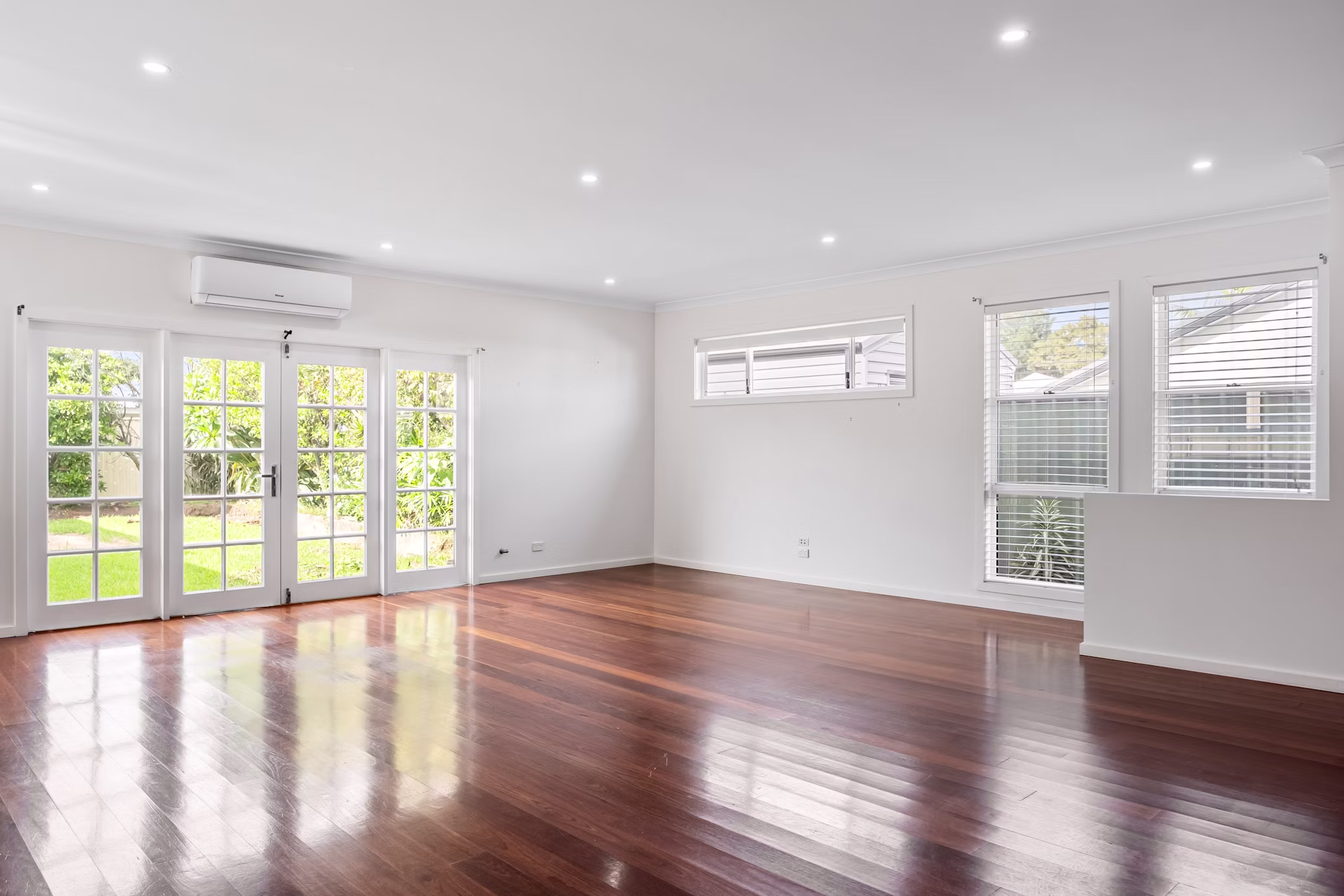 Freshly renovated empty room with patio doors