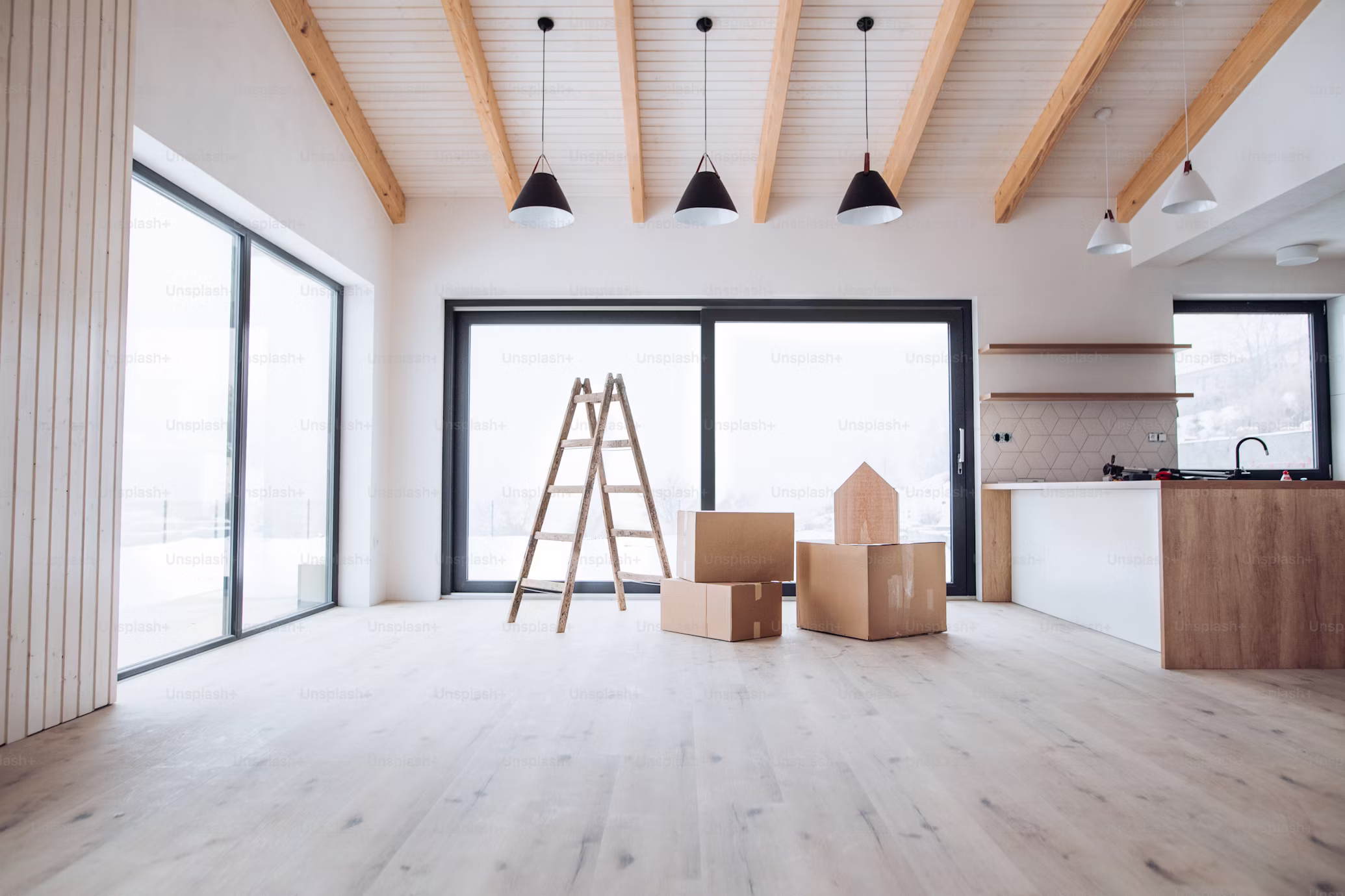 Bright interior renovation with ladder and materials